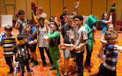 Kids playing with Nerf toys at Soonercon