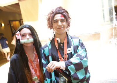 Cosplayers show off their cosplays of Tanjiro and Nezuko from Demon Slayer.