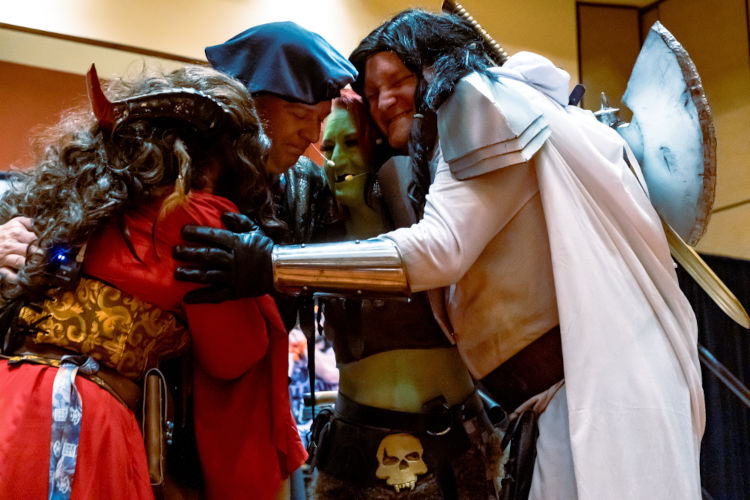 Cosplayers hug