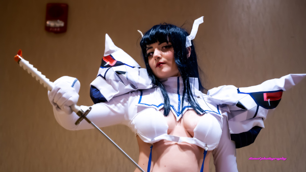 Cosplayers hug
