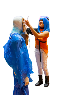 Participant dresses a mannequin